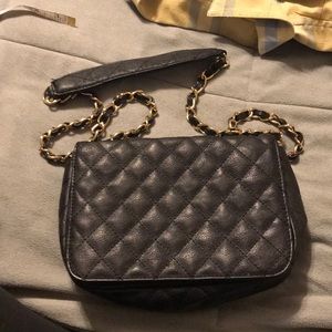 XXI black quilted w/gold tone purse